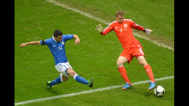 Italian forward Antonio Di Natale vies with German goalkeeper Manuel Neuer