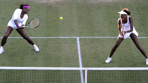 U.S. players Serena Williams, left, and Venus WIlliams in their first-round women's doubles match against Ukraine's Olga Savchuk and Serbia's Vesna Dolonc on June 28.