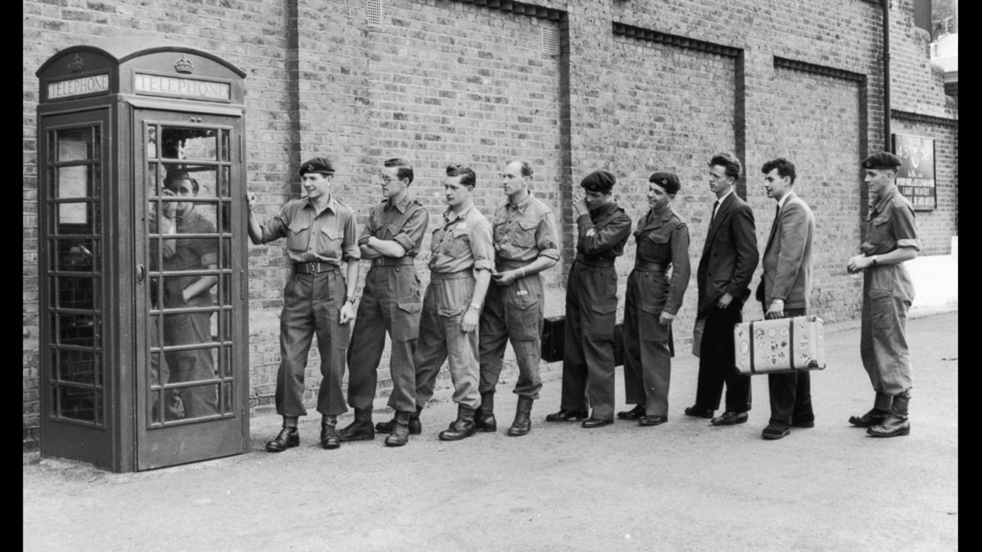 Here English troops call their loved ones in 1956 after being told to prepare for duty in the Suez Canal Zone. Payphones were common until cell phones became popular and affordable.