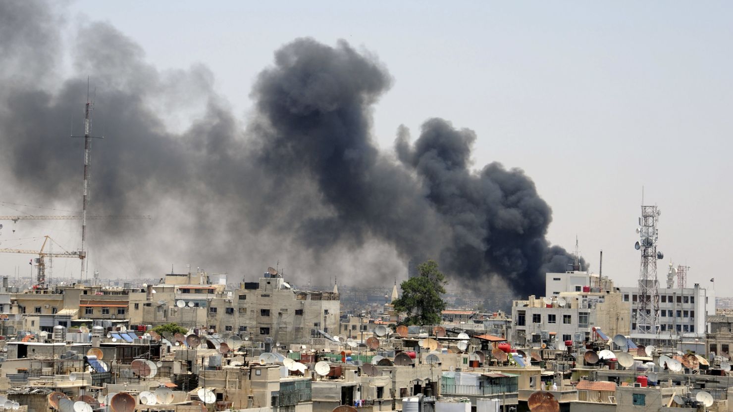 Smoke rises after an explosion Thursday near the Palace of Justice in central Damascus, Syria.