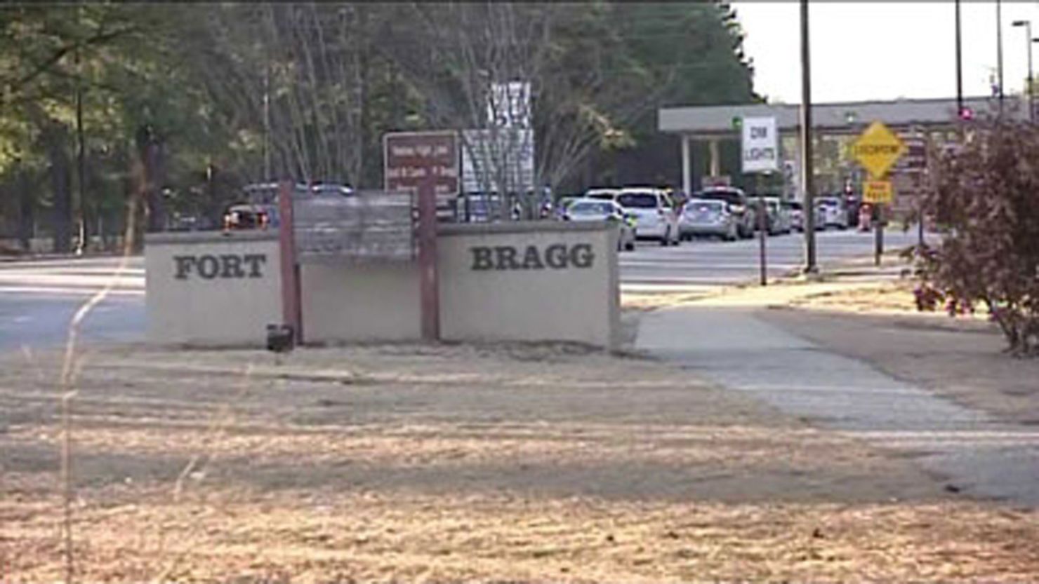 Officials say a man shot an officer to death before shooting himself at Fort Bragg on Thursday. A specialist also was wounded.