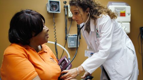 Brenda Major gets a checkup from Dr. Fernanda Mercade at a clinic in Miami on March 22.