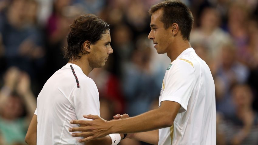 Lukas Rosol of the Czech Republic shakes hands with Rafael Nadal of Spain after defeating him during their Gentlemen's Singles second round match on day four of the Wimbledon Lawn Tennis Championships at the All England Lawn Tennis and Croquet Club on June 28, 2012 in London, England