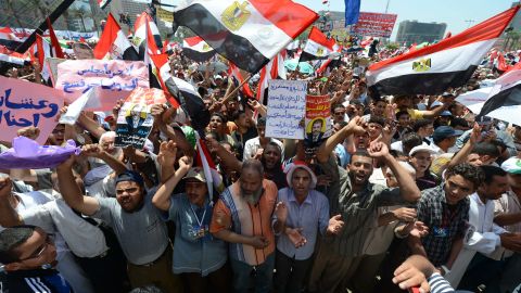 Egyptians wave national flags during a rally in support of president-elect Mohamed Morsi in Cairo's Tahrir Square on June 29.