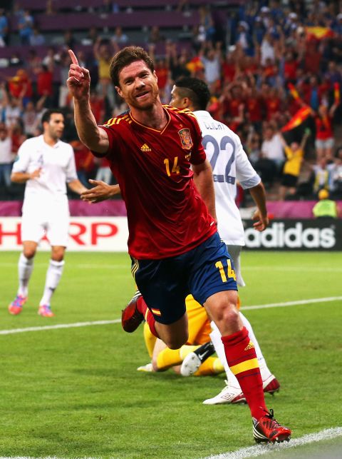 Xabi Alonso scored both of Spain's goals in the quarterfinal against France, leading the champions into a showdown with neighbors Portugal on the occasion of his 100th cap.