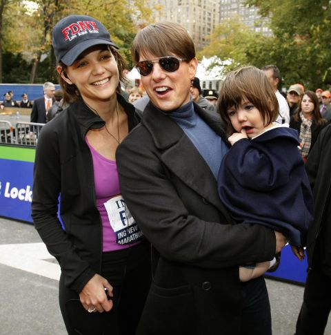 Cruise and daughter Suri cheer Holmes on when she ran the New York City Marathon in November 2007.