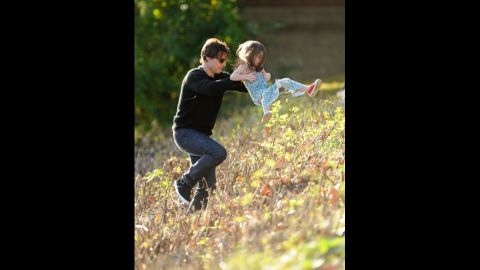 Cruise plays with Suri in Cambridge on October 10, 2009. Cruise's lawyer said the actor "is very sad about [the divorce] and is concentrating on the kids."