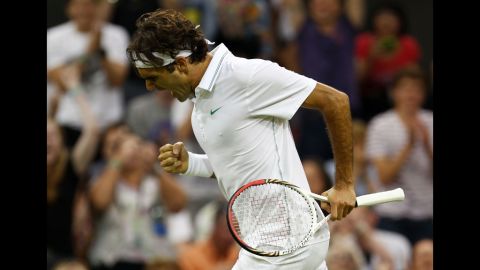 Roger Federer of Switzerland celebrates set point during his third-round singles match against Julien Benneteau of France in the Wimbledon Championships in London on Friday, June 29. 