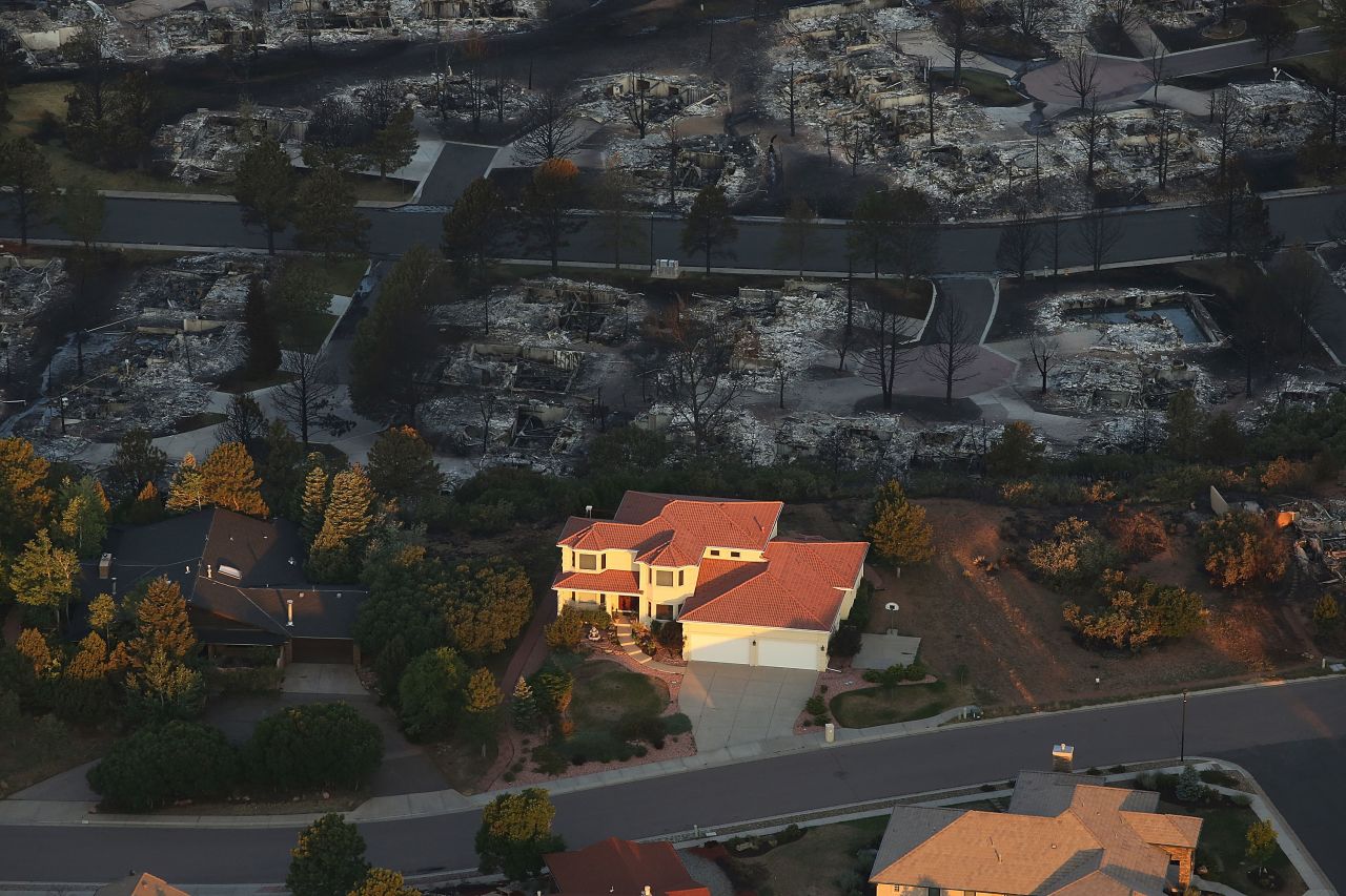 One home stands surrounded by others destroyed by the Waldo Canyon fire in Colorado Springs on Saturday.