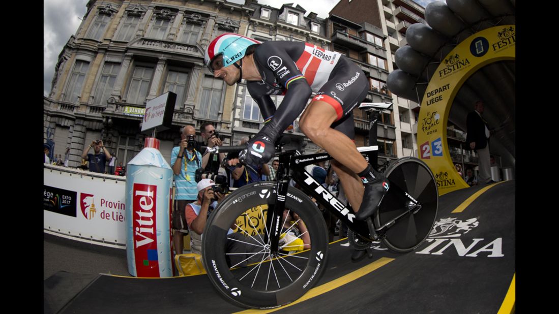 Fabian Cancellara of Switzerland lunges out of the starting gate for the individual time trial and first test in the 2012 Tour de France in Liege, Belgium, on Saturday, June 30. 