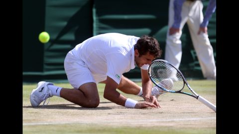 Marin Cilic of Croatia falls to the ground Saturday during play in his match against Sam Querrey of the United States.