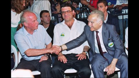Shamir and Labor Party leader Yitzhak Rabin shake hands in Qatzerin on the Golan Heights  on June 10, 1992. The two candidates for prime minister were at an event commemorating the 25th anniversary of the capture of the Golan Heights from Syria.