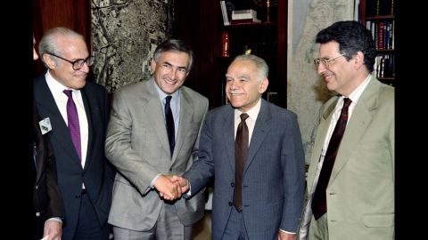 French foreign trade official Dominique Strauss-Kahn, center left, shakes hands with Shamir on May 27, 1992, in Jerusalem during an official visit.