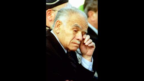 Shamir wipes his eye during a commemorative ceremony on May 5, 1992, in Jerusalem for soldiers who died in Israel's wars.