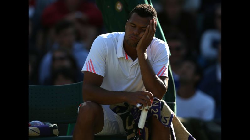 Jo-Wilfried Tsonga of France take a break during his third-round singles match against Lukas Lacko of Slovakia on Saturday.