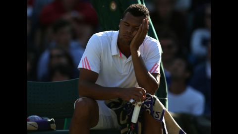 Jo-Wilfried Tsonga of France take a break during his third-round singles match against Lukas Lacko of Slovakia on Saturday.