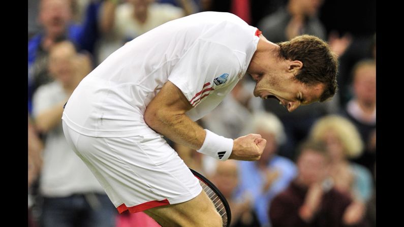 Britain's Andy Murray celebrates taking the third set of his third-round men's singles match against Cyprus' Marcos Baghdatis on day six of Wimbledon on Saturday, June 30.
