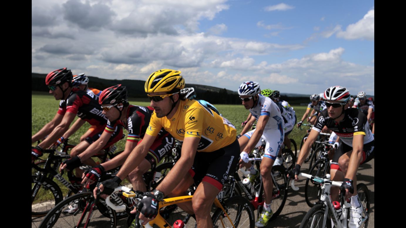 Cancellara, wearing the yellow jersey, rides alongside Cadel Evans of Australia, second from left, and Frank Schleck of Luxembourg, left, on Sunday.