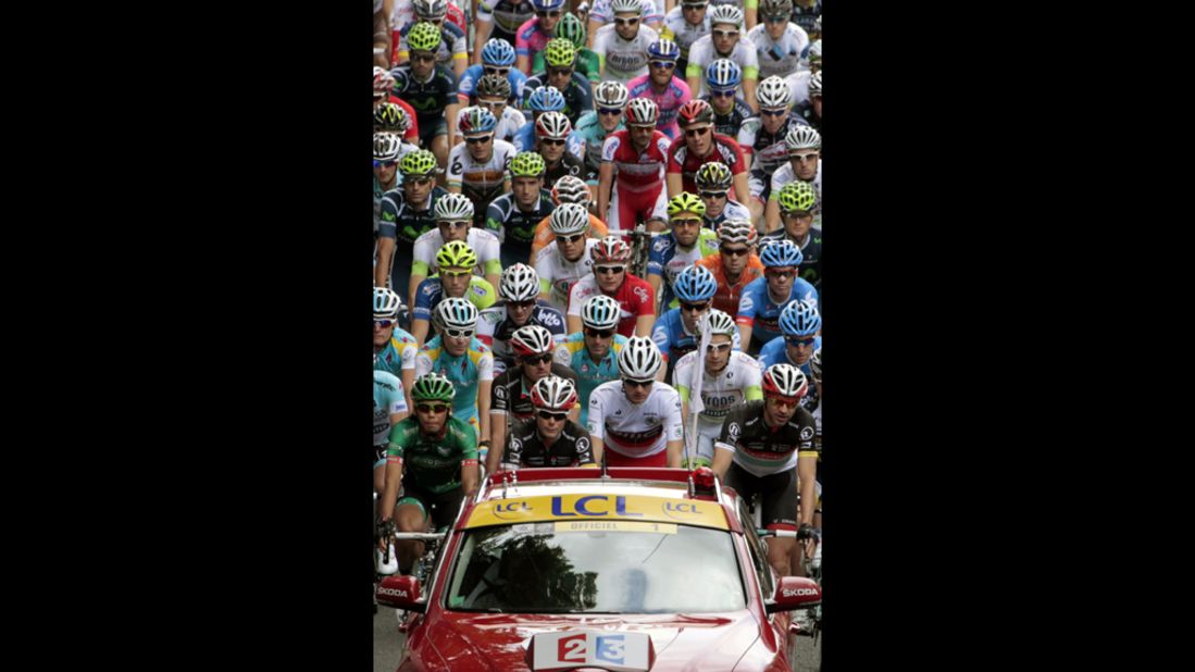 The peloton follows the official Tour de France vehicle at the beginning of Sunday's Stage 1.
