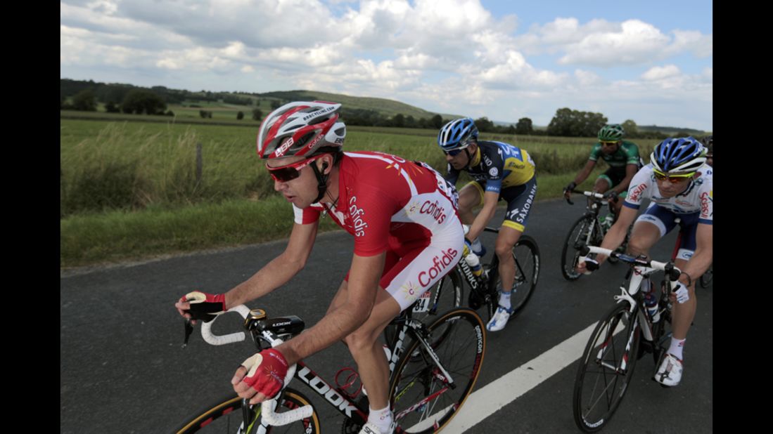 A group of six riders, including Nicolas Edet of France, left, breaks away from the main group very early in Stage 1on Sunday. The riders were able to maintain a gap of several minutes until they were eventually caught about 8 kilometers (5 miles) from the finish line.