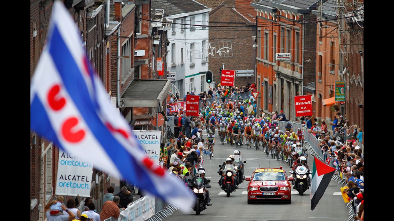 The peloton begins the final climb of Sunday's stage, called the Cote de Seraing, as riders near the finish of the 198-kilometer (123-mile) course.