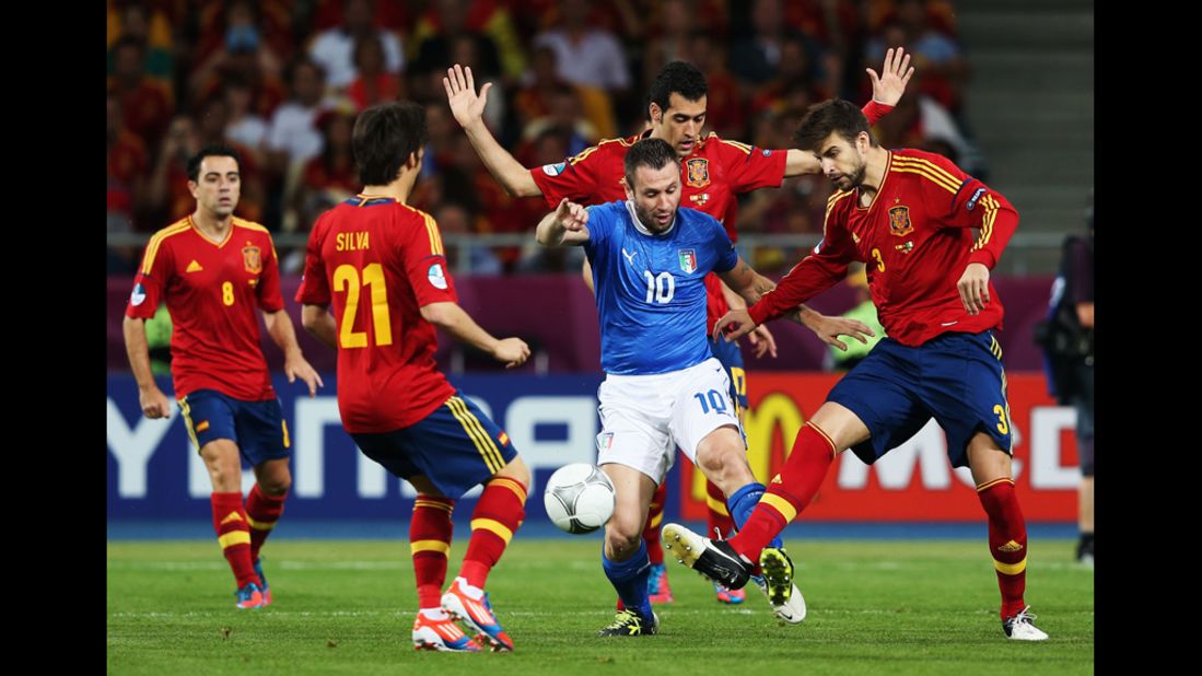Antonio Cassano of Italy battles for the ball during the final match against Spain.