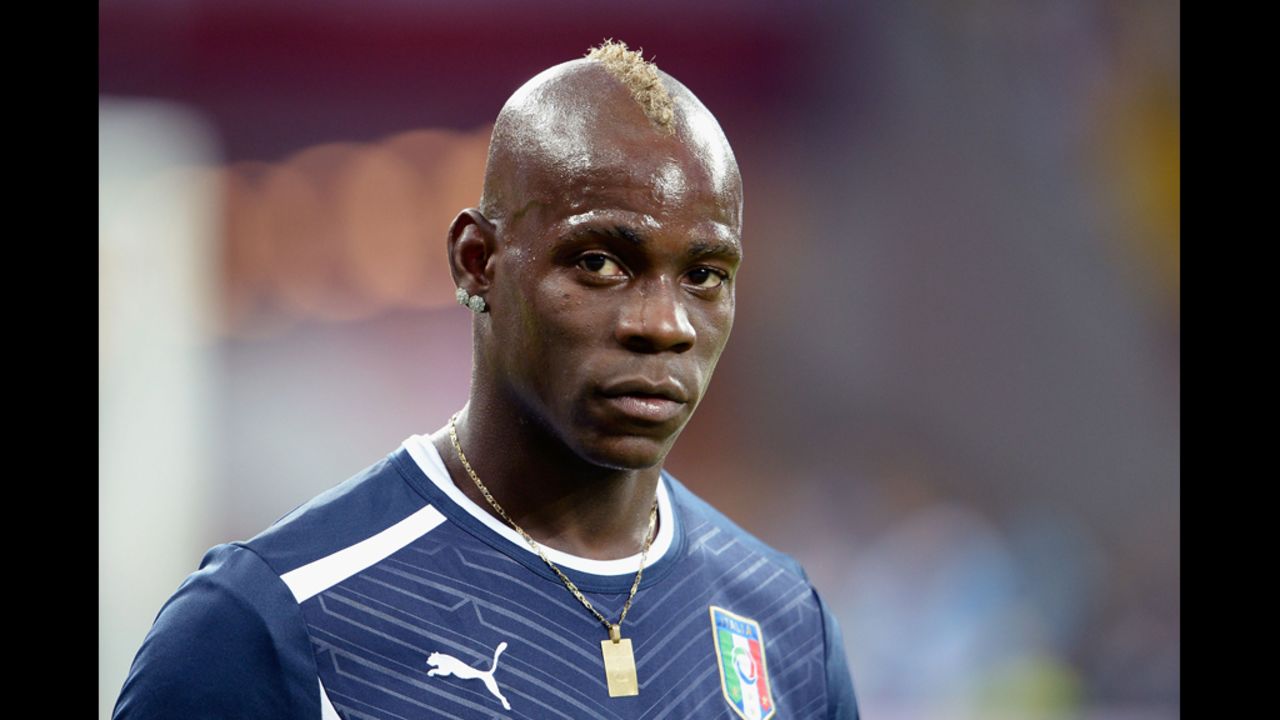 Italy's Mario Balotelli of Italy warms up ahead of Sunday's match againt Spain.