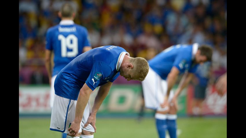 Ignazio Abate of Italy, left, shows his dejection after Spain scored a second goal.