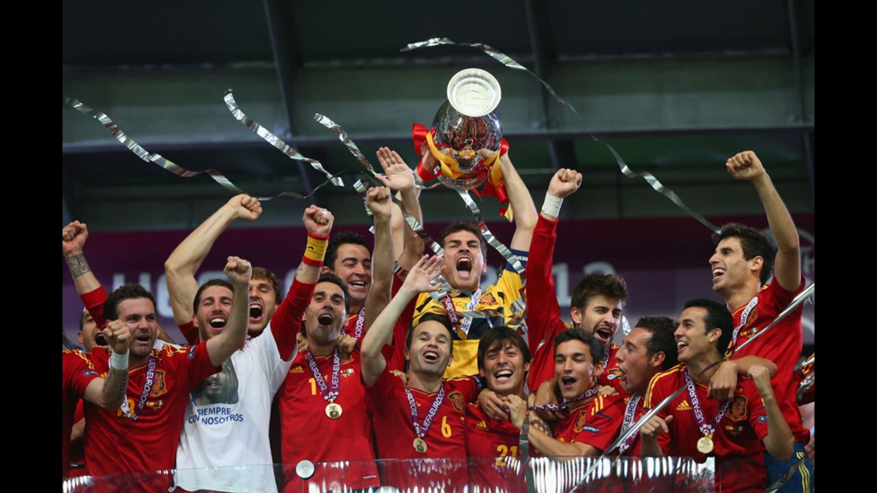 Spain celebrates after defeating Italy on Sunday. It was the team's third successive major international trophy.