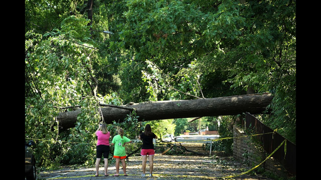 Local residents observe damages in Falls Church, Virginia.