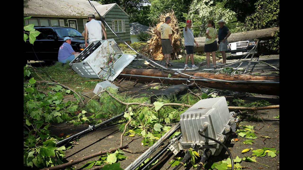 Downed power lines and transformer boxes litter the street in in Falls Church, Virginia.