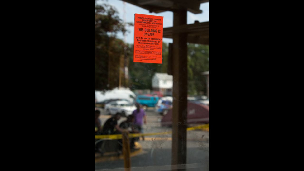A public notice is displayed on the mirrored doors of the seven-story Park Tanglewood Apartments in Riverdale.