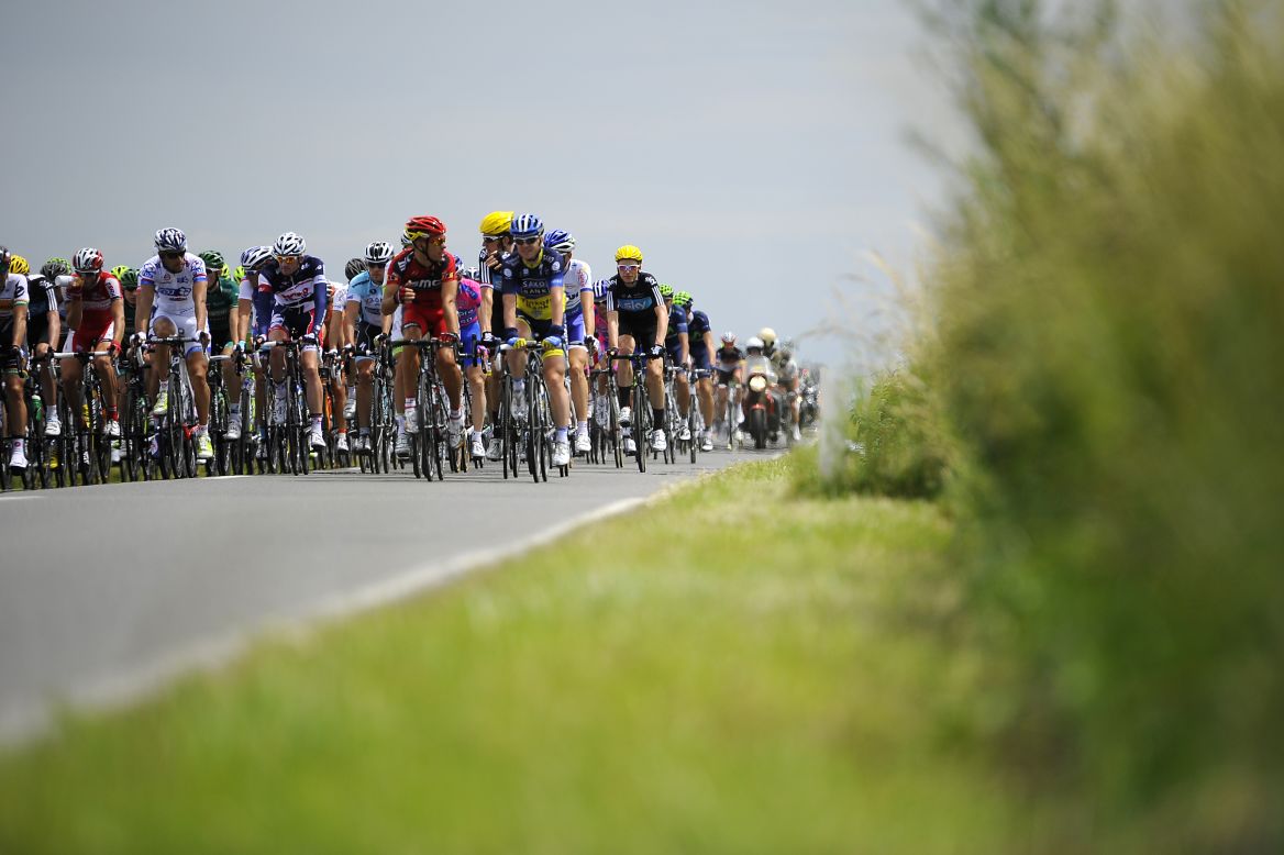 The main group of riders quickly fell several minutes behind the breakaway group as they traveled along Belgian roads Monday.