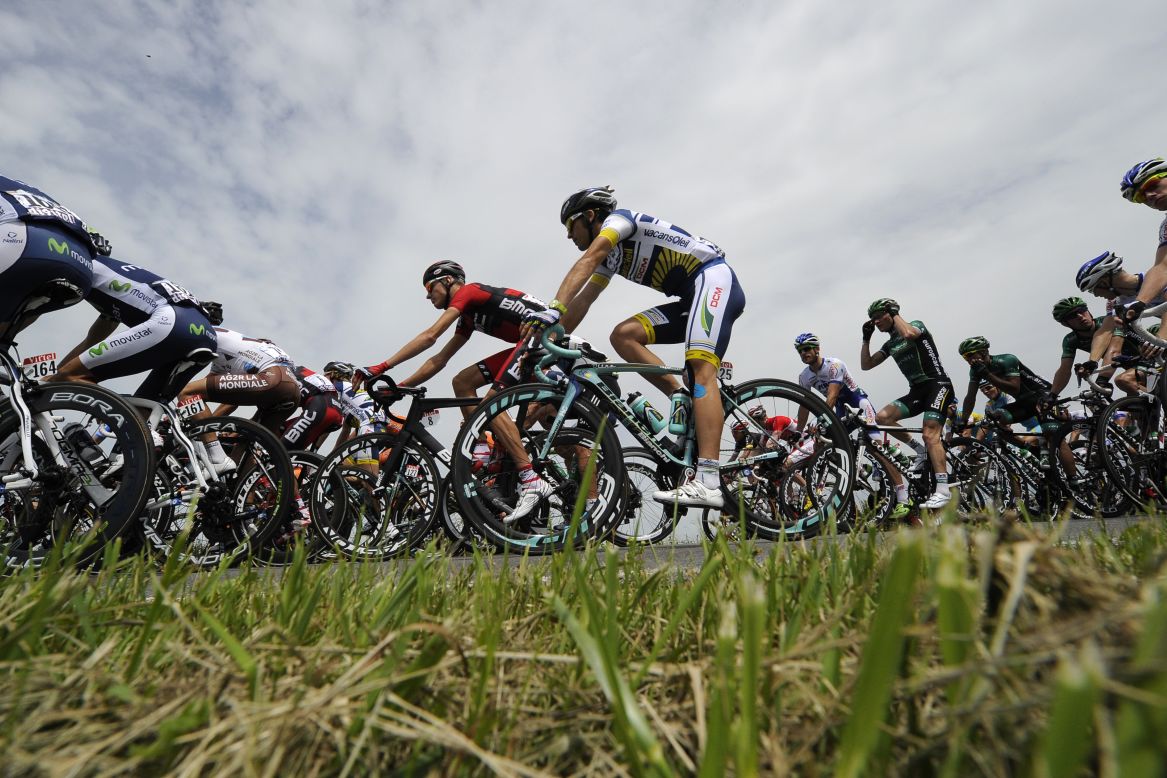 The peloton races through the Belgian countryside Monday.