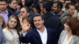 The presidential candidate for Mexico's Institutional Revolutionary Party (PRI), Enrique Peña Nieto, waves after casting his vote in the presidential elections, in Atlacomulco, state of Mexico, on July 1, 2012.