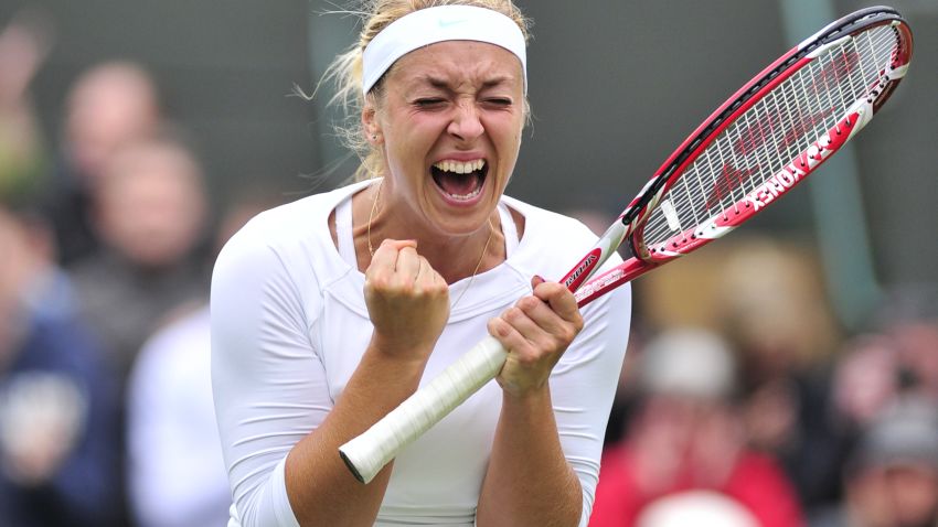 Germany's Sabine Lisicki celebrates her fourth round women's singles victory over Russia's Maria Sharapova on day seven of the 2012 Wimbledon Championships tennis tournament at the All England Tennis Club in Wimbledon, southwest London, on July 2, 2012. AFP 