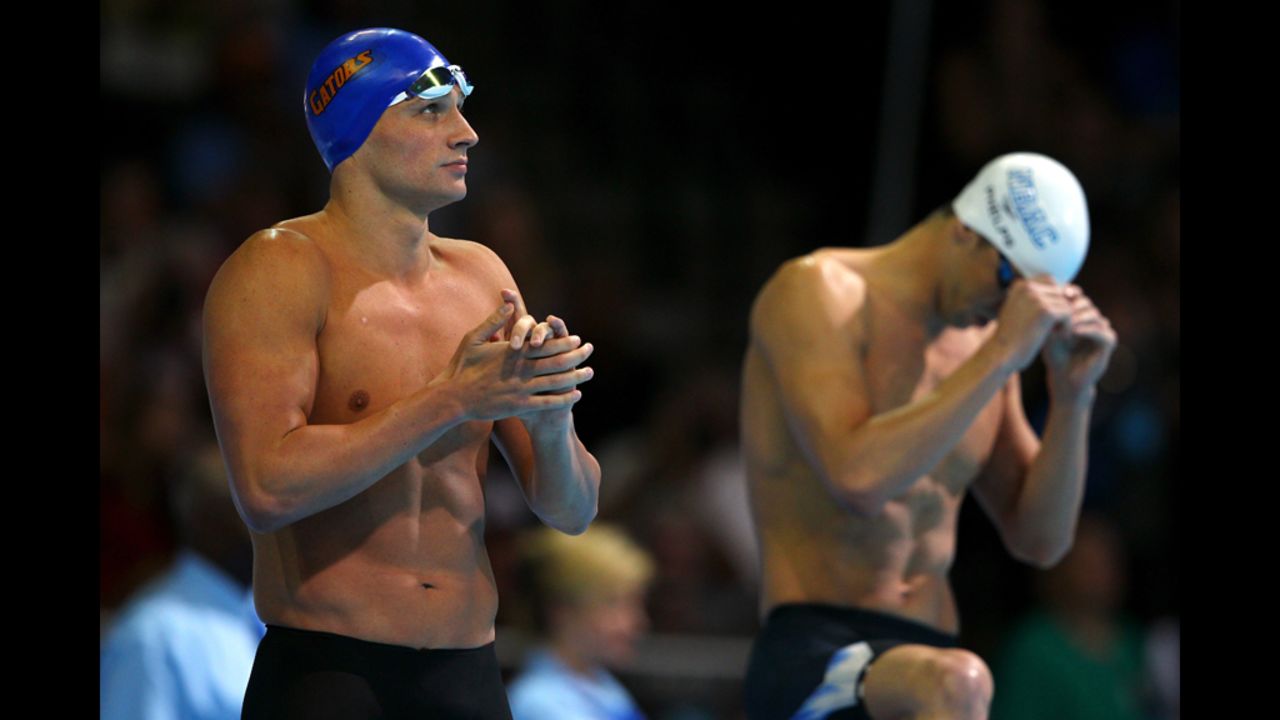 Ryan Lochte, left, and Michael Phelps prepare to swim in the championship final of the Men's 200-meter Backstroke during Day Six of the 2012 U.S. Olympic Swimming Team Trials.
