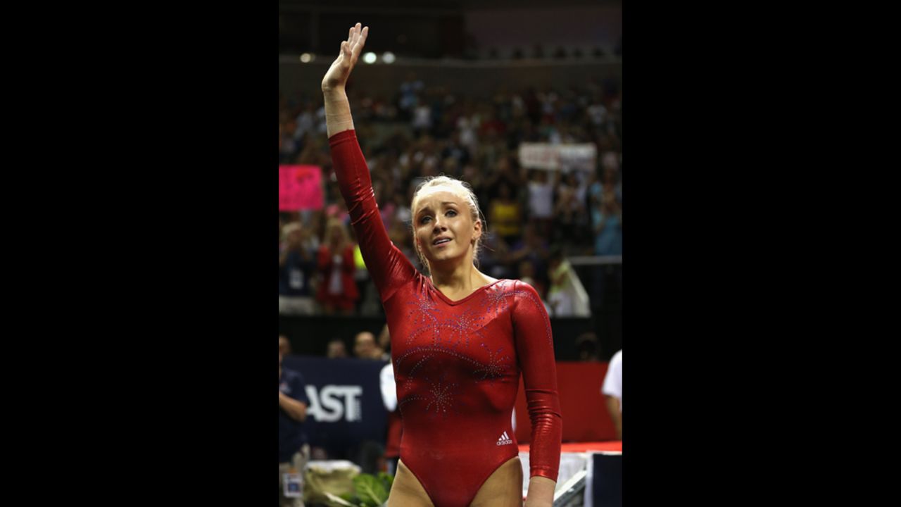 Nastia Liukin waves to the crowd after competing on the beam during Day Four of the 2012 U.S. Olympic Gymnastics Team Trials.
