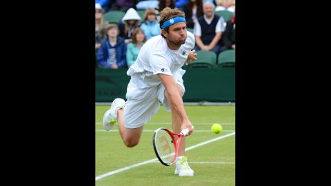 Mardy Fish of USA plays a forehand shot against Jo-Wilfried Tsonga on Monday.