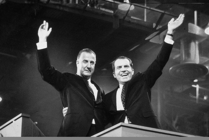 Republican presidential candidate Richard M. Nixon (R) and his running mate Spiro Agnew wave to crowds during the campaign, circa 1968.