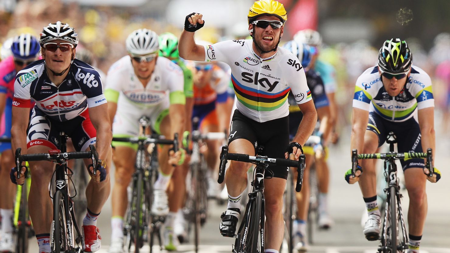 Mark Cavendish crosses the line in triumph ahead of Andrei Greipel and Matt Goss on the second stage of the Tour de France. 