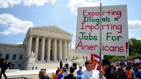 A supporter of Arizona's immigration policy pickets outside the U.S. Supreme Court in Washington in April.