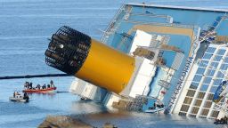 The cruise ship Costa Concordia lies stricken off the shore of the island of Giglio on January 21, 2012 in Giglio Porto, Italy. The body of a woman was recovered by Italian coast guard divers from the capsized cruise ship Costa Concordia, raising the death toll to 12. (Photo by Tullio M. Puglia/Getty Images) 