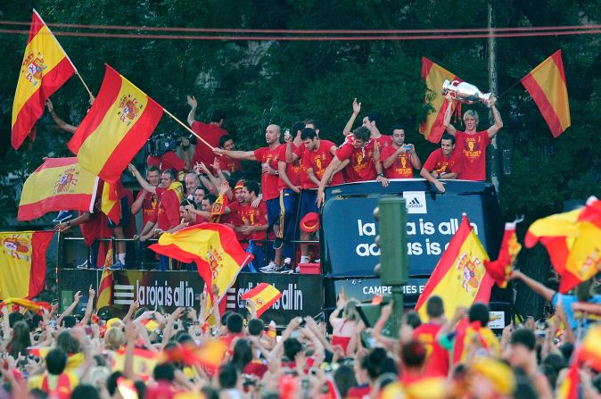 Torres holds aloft the Euro 2012 trophy during a victory parade after Spain's triumph. He scored in the final against Italy.<br /> 
