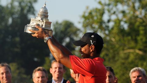 Tiger Woods lifts the AT&T National trophy after his two-shot victory at Congressional.