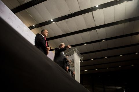 Projected as the runner-up in Sunday's vote, Andres Manuel Lopez Obrado, right, speaks in Mexico City on Monday. He said he was awaiting the official election results and prepared to contest them before judicial authorities if they didn't turn out in his favor.