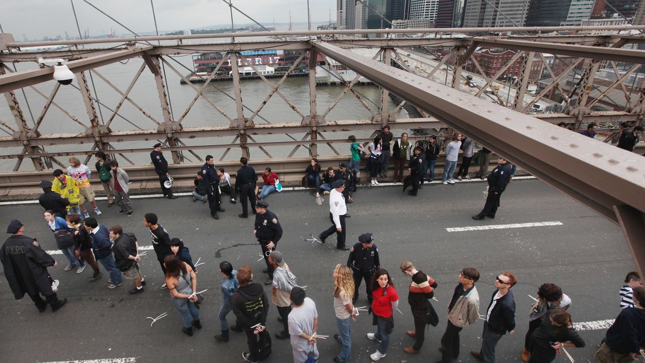 New York police lead away Occupy Wall Street protesters after they were arrested on the Brooklyn Bridge last October 1.