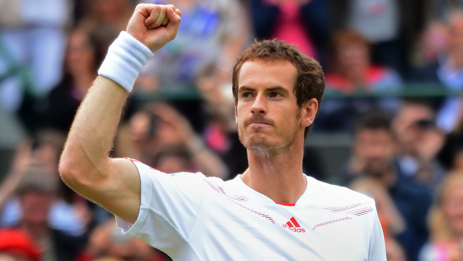 Britain's Andy Murray toasts the win over Marin Cilic that sealed his place in the last eight at Wimbledon