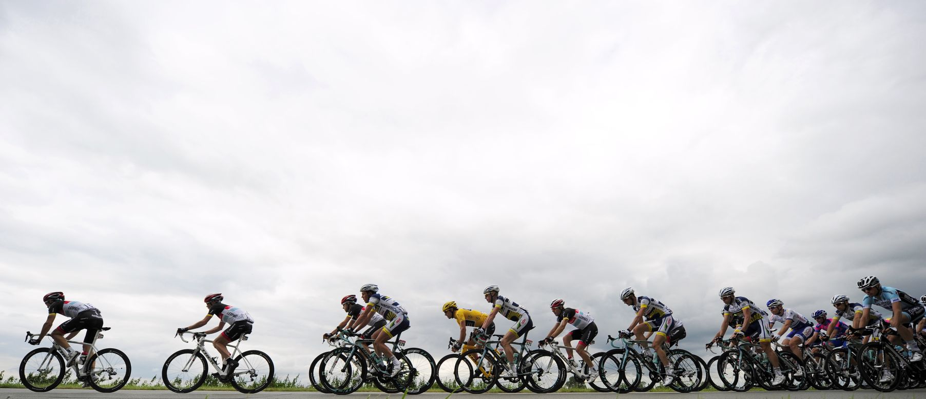 Overall race leader Fabian Cancellara of Switzerland, in yellow jersey, rides in the main group during Tuesday's 197-kilometer (122-mile) stage.