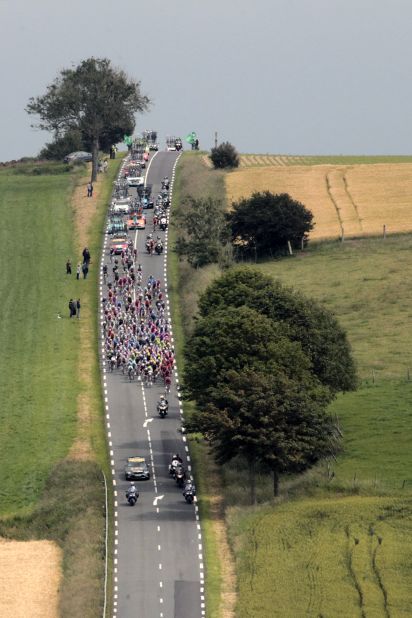 The peloton, the main group of riders, descends a hill during Stage 3.